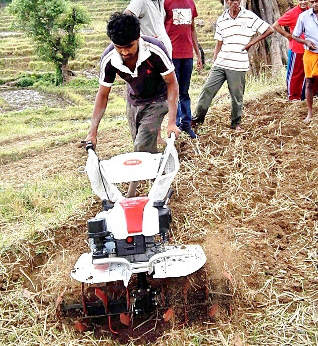 Cusomer field testing Tennma Power Tiller